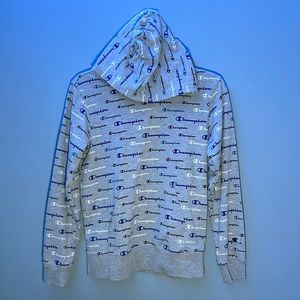 Youth large, grey champion hoodie with black, white, and blue lettering.